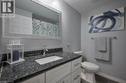 Bathroom with vanity and a shower with curtain -