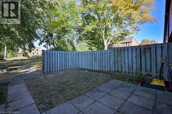 Fenced backyard featuring a patio area -