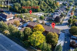 Aerial view of property and surrounding area with nearby suburban area -