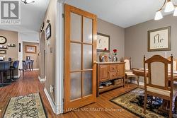 Dining room and view of front hallway to kitchen -