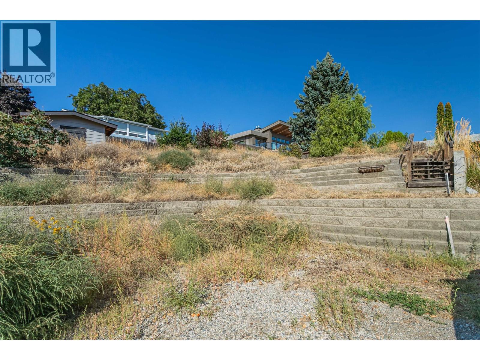 current retaining wall bricks could be re-used - 5493 Solly Road, Summerland, BC