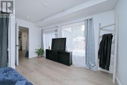 Main Floor Bed 2, large windows -