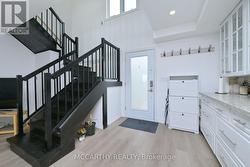 Entry with beautifull wooden stair case -