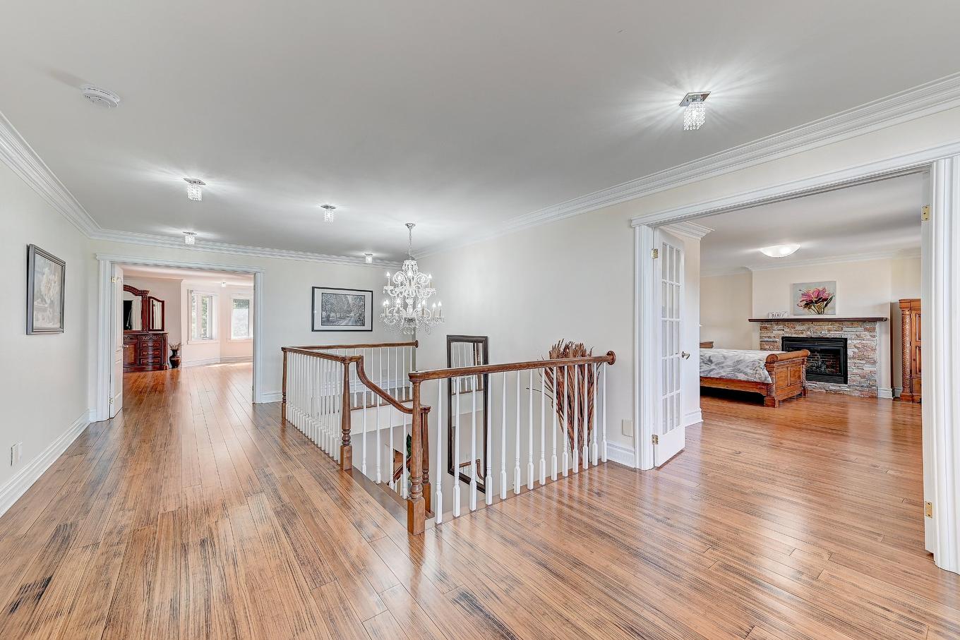 Corridor - 136 Rue Jean-De Ronceray, Carignan, QC - Indoor Photo Showing Other Room With Fireplace