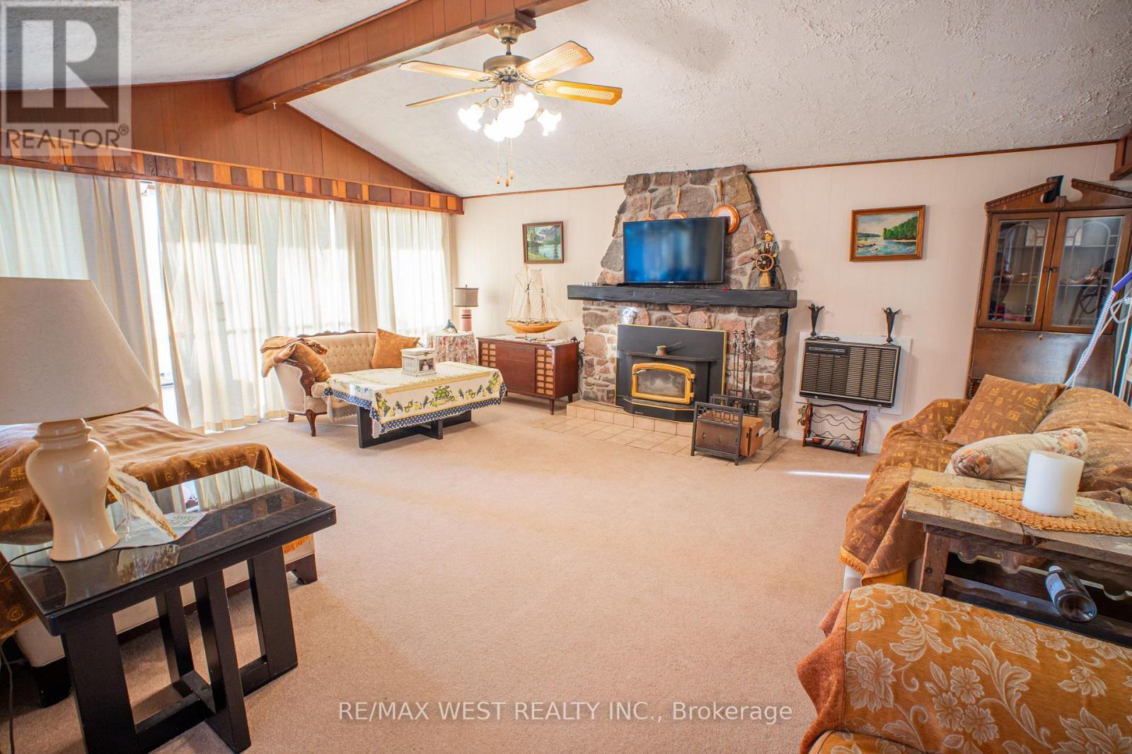 1392 Island View Drive, Selwyn, ON - Indoor Photo Showing Living Room With Fireplace