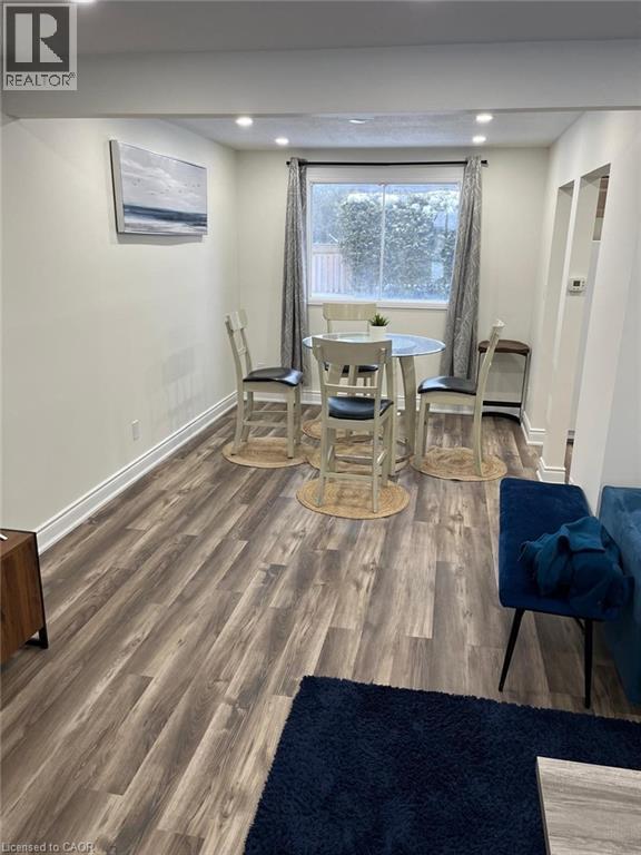 Dining room featuring wood finished floors and recessed lighting - 389 Dunvegan Drive, Waterloo, ON - Indoor
