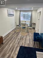 Dining room featuring wood finished floors and recessed lighting -