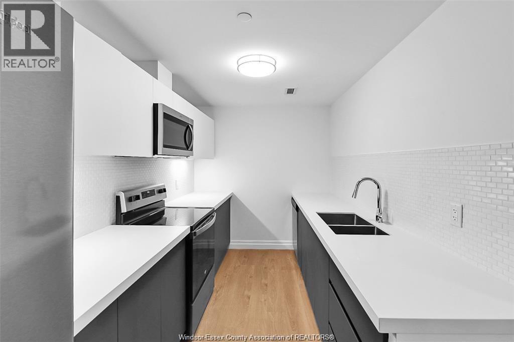 3290 Stella Crescent Unit# 604, Windsor, ON - Indoor Photo Showing Kitchen With Double Sink With Upgraded Kitchen