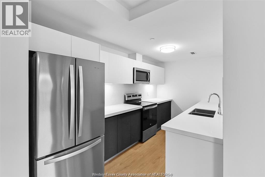 3290 Stella Crescent Unit# 604, Windsor, ON - Indoor Photo Showing Kitchen With Stainless Steel Kitchen With Double Sink With Upgraded Kitchen