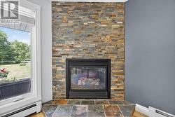 Gas fireplace insert in living room -