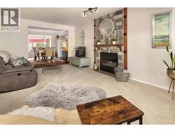 Spacious living room featuring a gas fireplace -