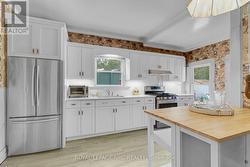 updated cabinetry, countertops and appliances -