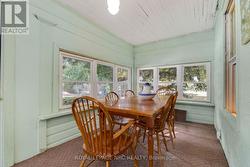 sunroom with woodstove and entrance to pool -