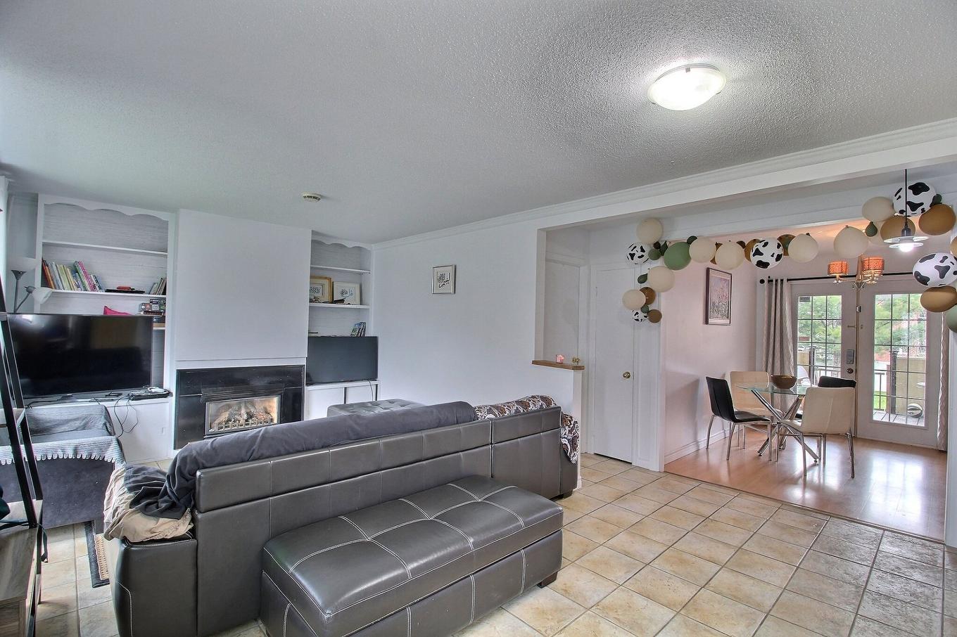 Overall view - 881 - 883 1Re Rue, Val-D'Or, QC - Indoor Photo Showing Living Room With Fireplace