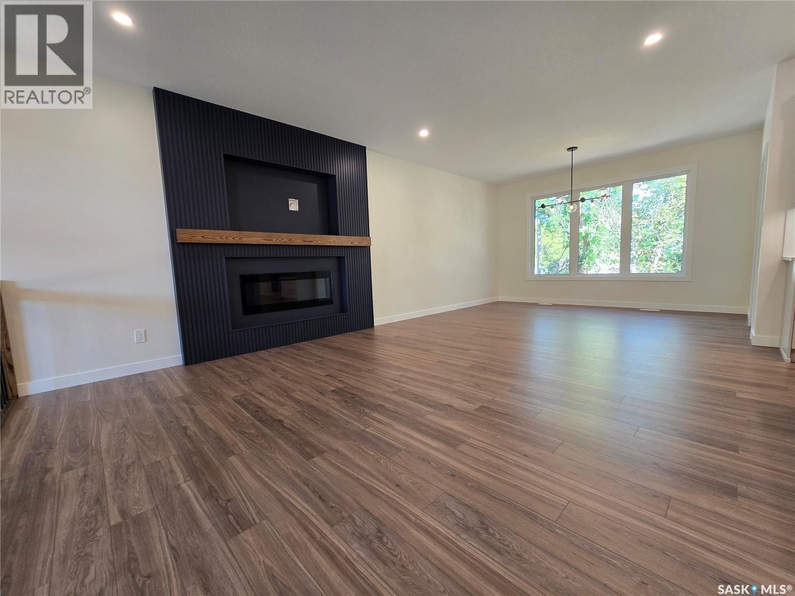 3 Kenney Crescent, Weyburn, SK - Indoor Photo Showing Living Room With Fireplace