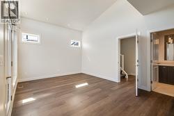 Primary bedroom with ensuite, walk-in closet, and generous patio! -