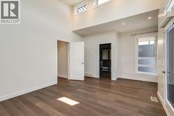 Primary bedroom with ensuite, walk-in closet, and generous patio! -