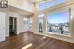 Tons of natural light in primary bedroom with vaulted ceilings! -