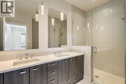 Double vanity & walk-in shower in primary ensuite -