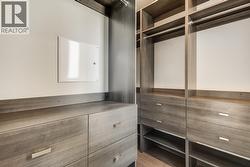 Walk-in closet in primary bedroom -