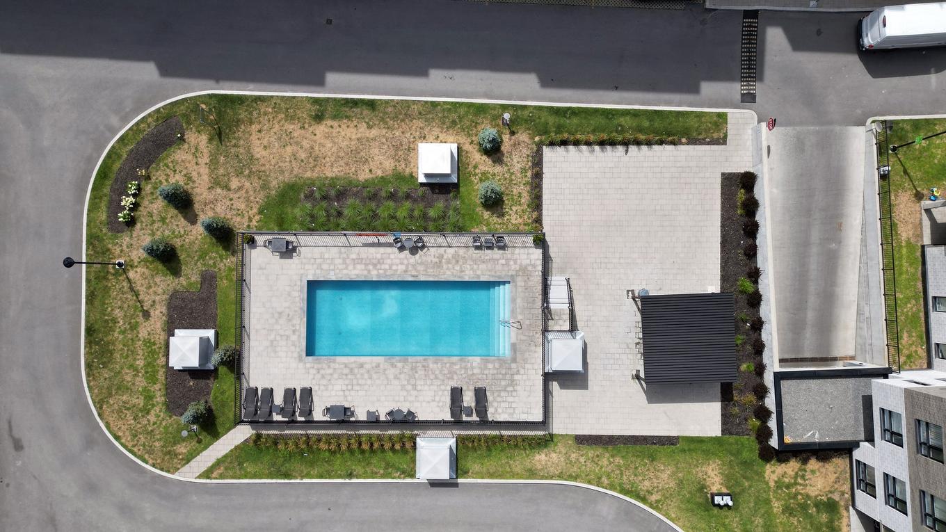 Aerial photo - 211-1431 Av. De La Gare, Mascouche, QC - Outdoor With In Ground Pool