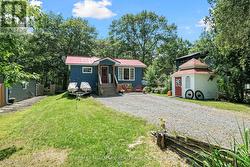 Front view of home showing the 3rd shed at right -