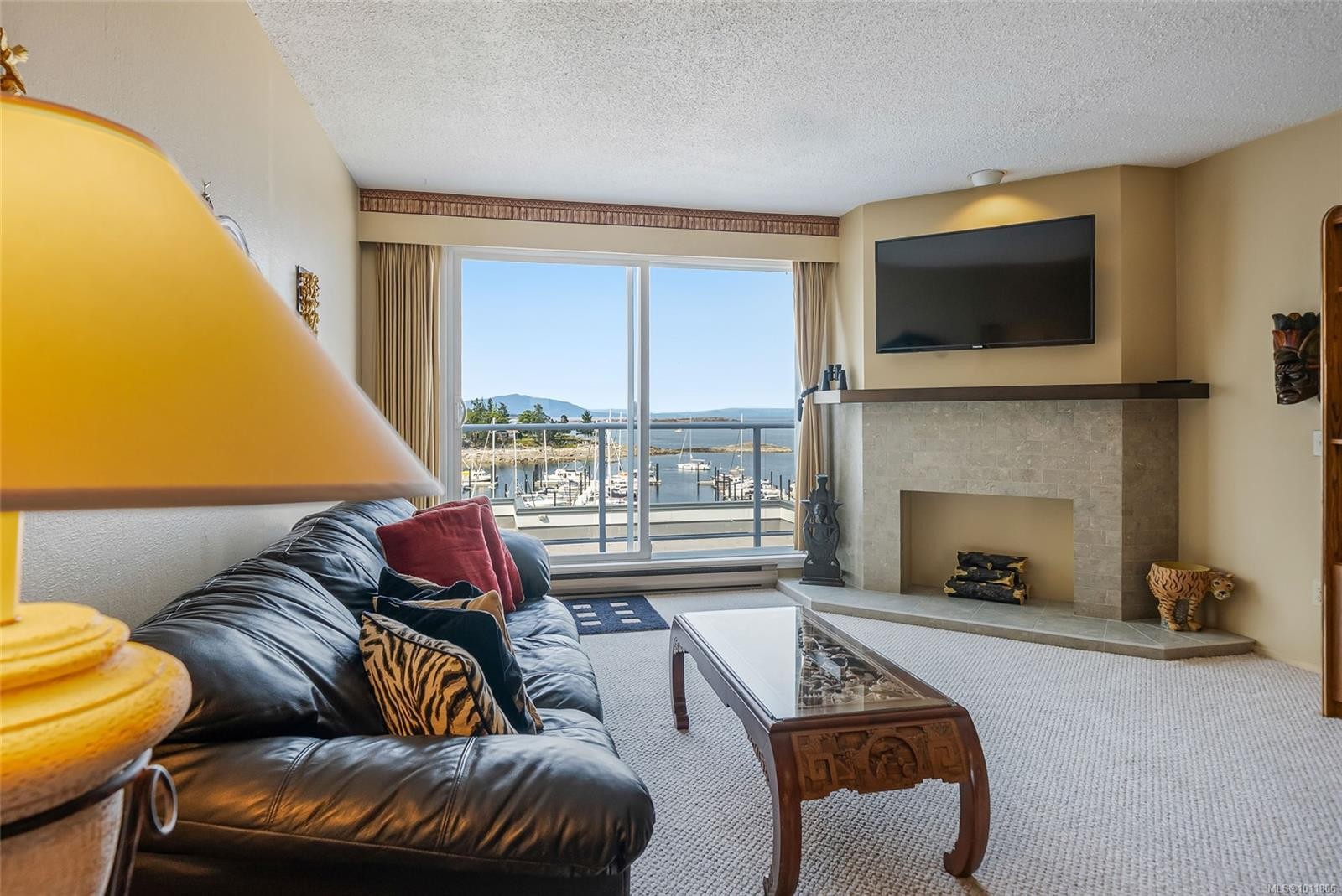 403-3555 Outrigger Rd, Nanoose Bay, BC - Indoor Photo Showing Living Room With Fireplace