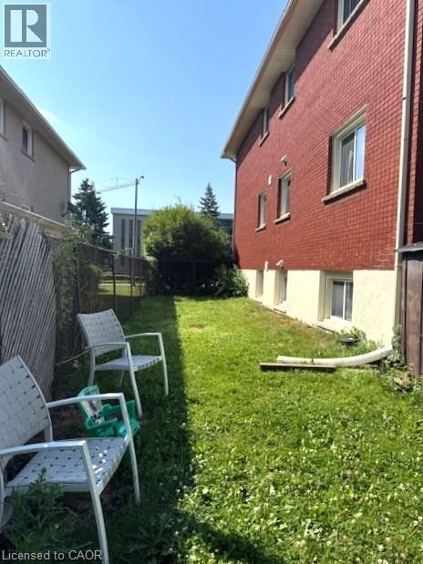 View of yard - 106 Chandler Drive Unit# 1, Kitchener, ON - Outdoor With Exterior