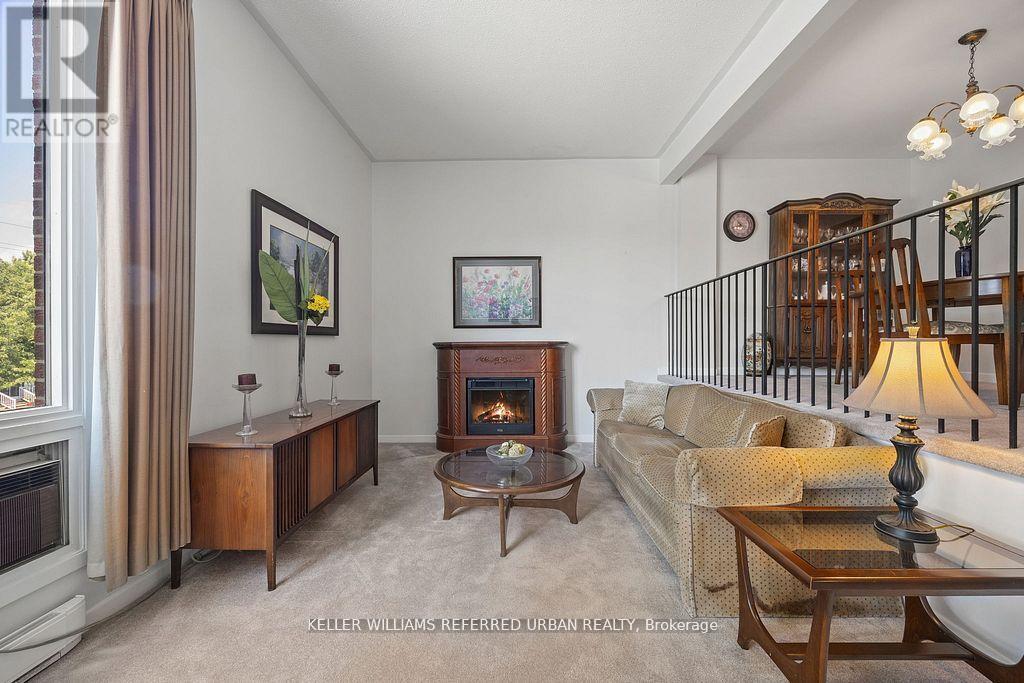 2 Sebastian Cabot Way, Toronto, ON - Indoor Photo Showing Living Room With Fireplace