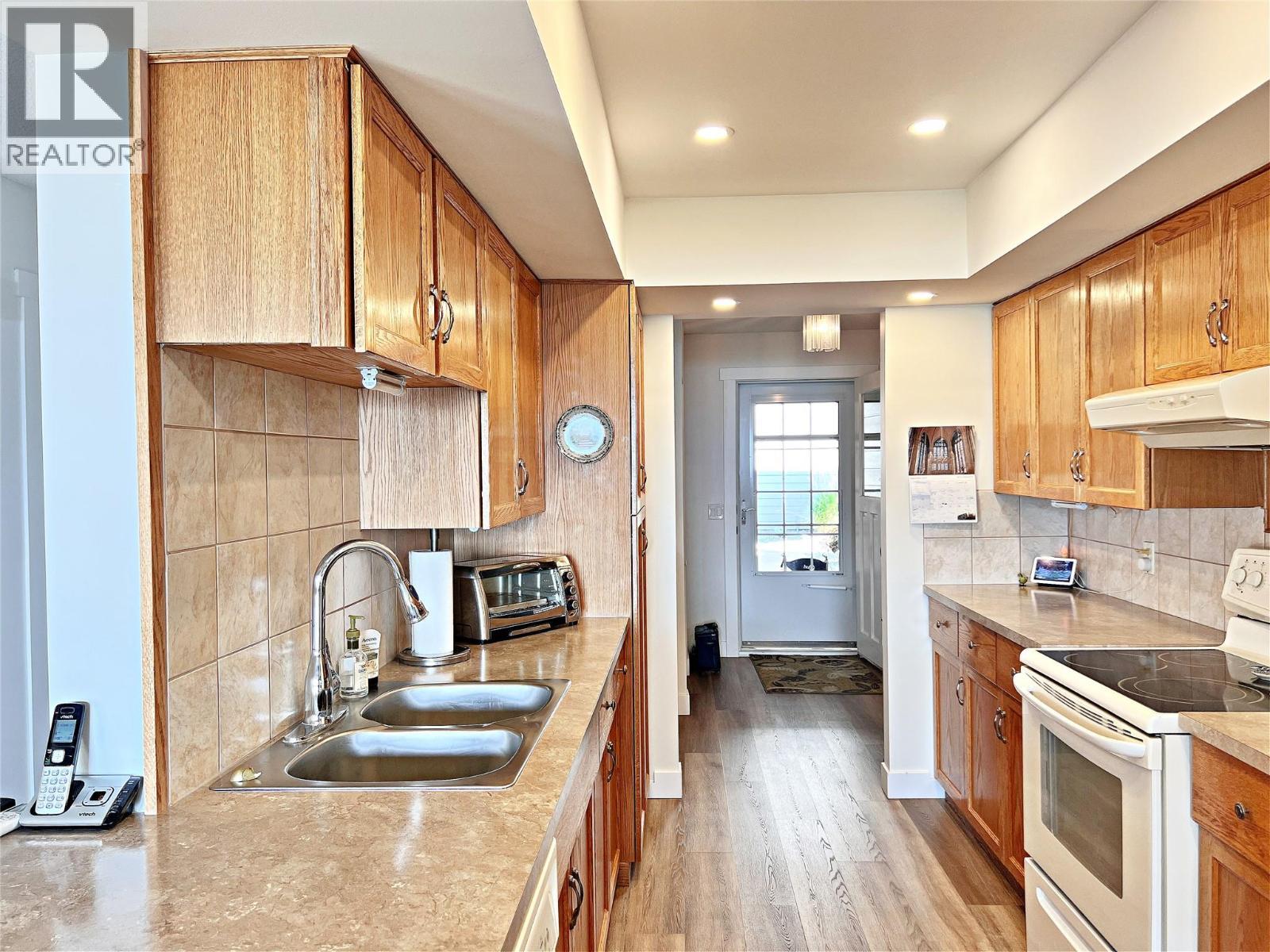 4340A Beach Avenue Unit# 102, Peachland, BC - Indoor Photo Showing Kitchen With Double Sink