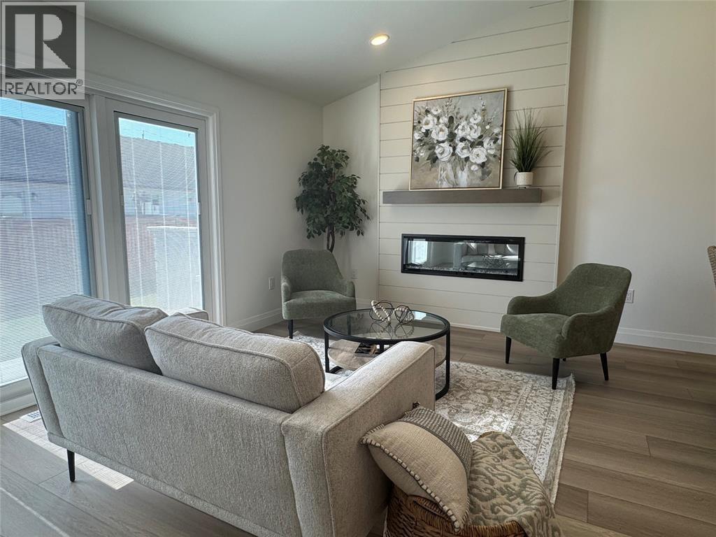 435 Queen Street Unit# 17, St Clair, ON - Indoor Photo Showing Living Room With Fireplace