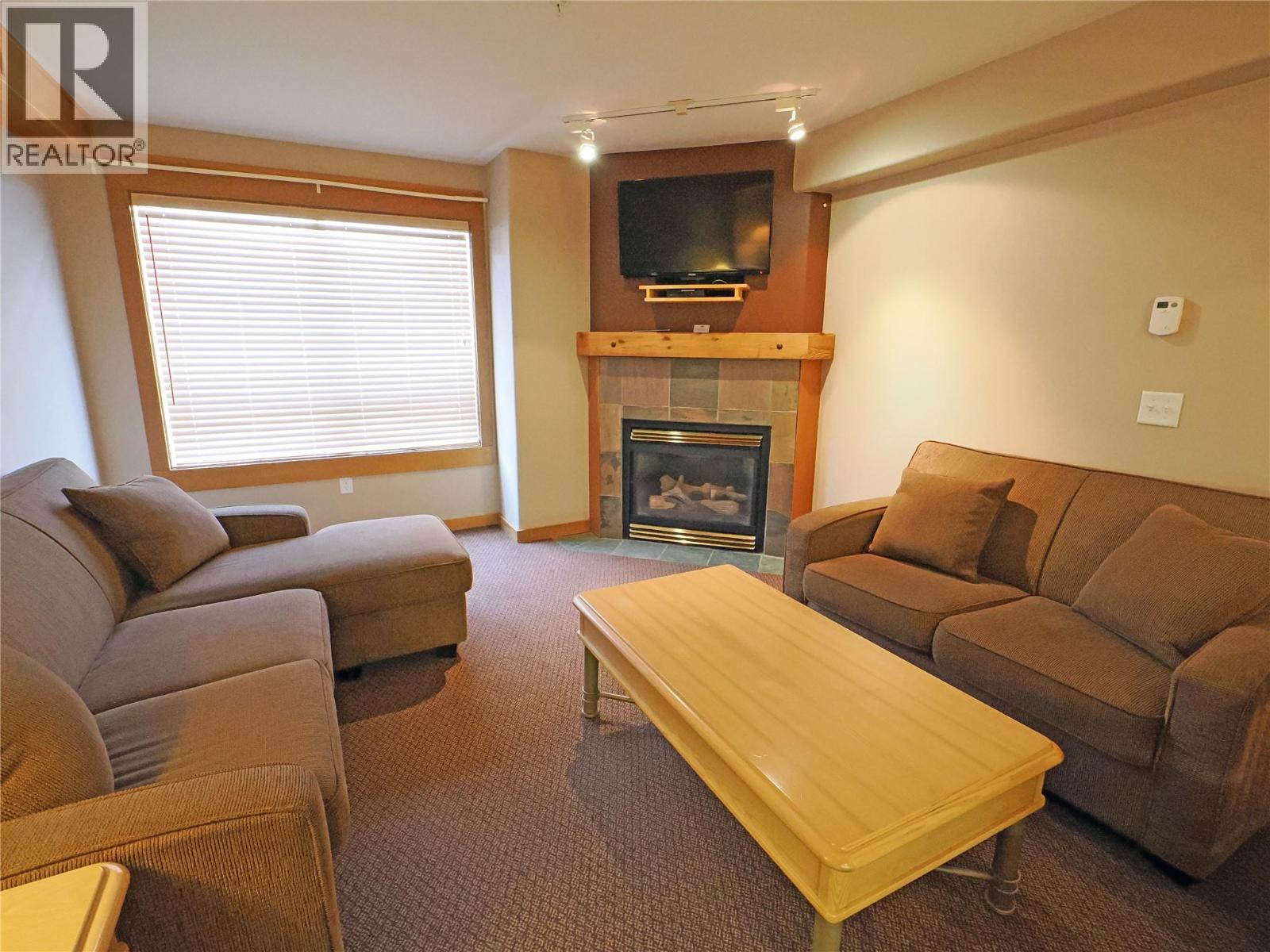 5335 Big White Road Unit# 303/305, Big White, BC - Indoor Photo Showing Living Room With Fireplace