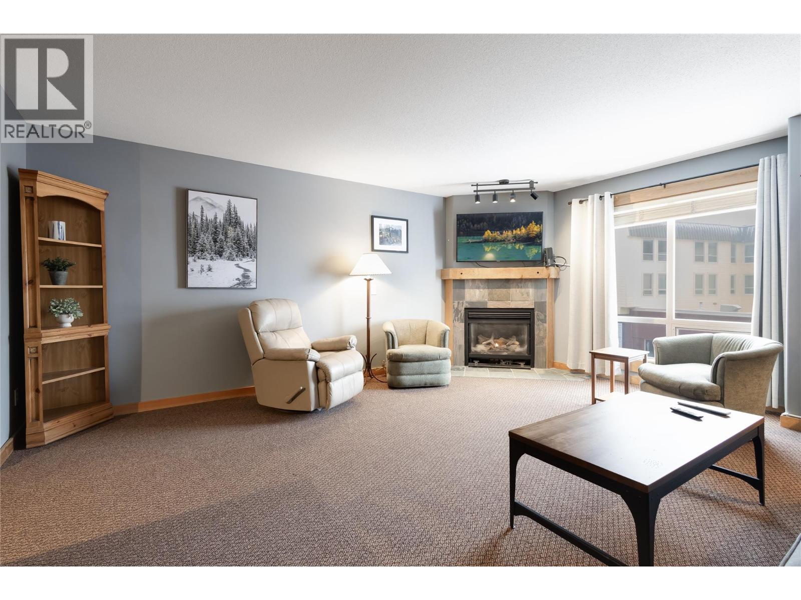 5335 Big White Road Unit# 401, Big White, BC - Indoor Photo Showing Living Room With Fireplace