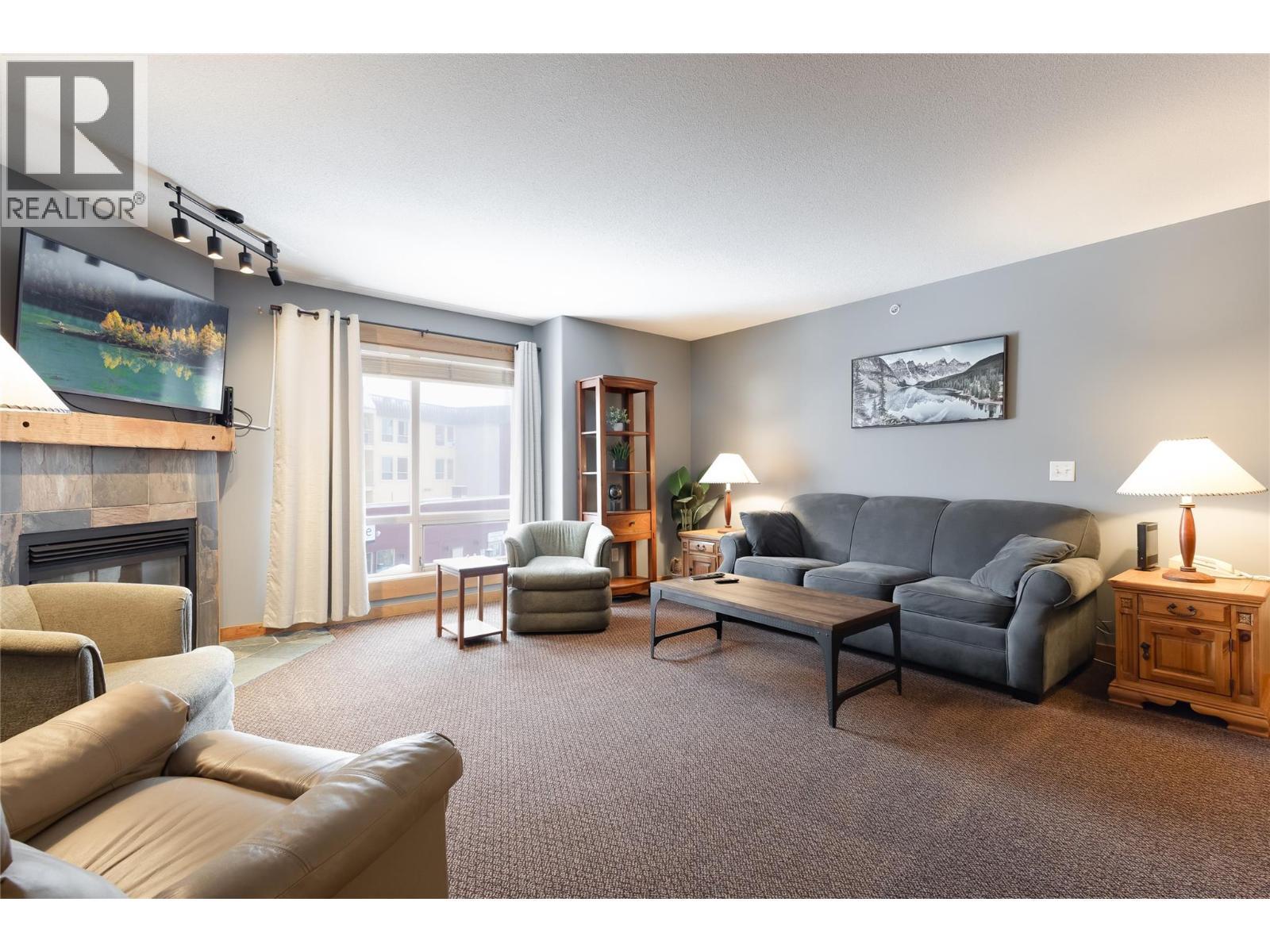 5335 Big White Road Unit# 401, Big White, BC - Indoor Photo Showing Living Room With Fireplace