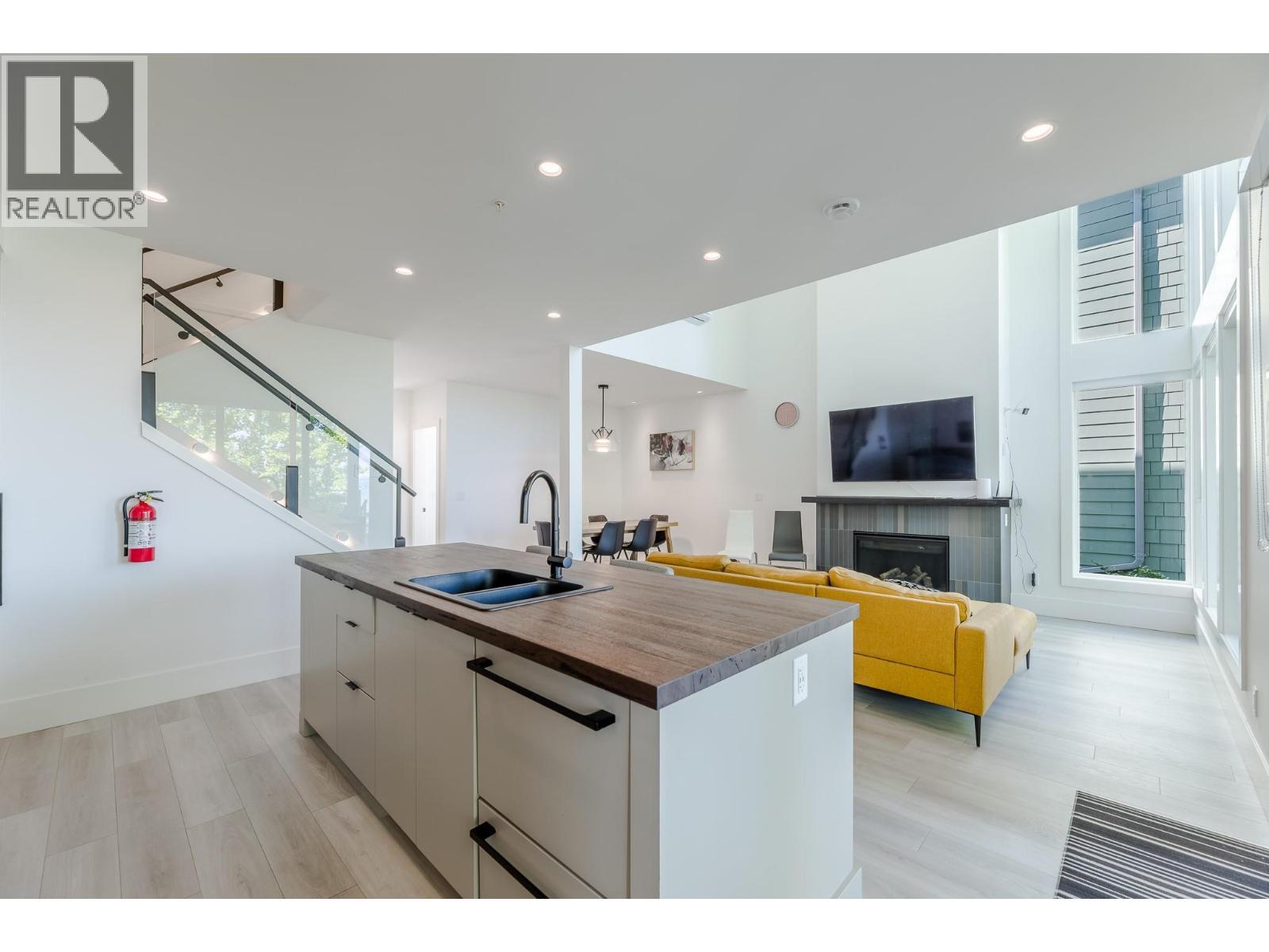 3240 Landry Crescent, Summerland, BC - Indoor Photo Showing Kitchen With Fireplace With Double Sink
