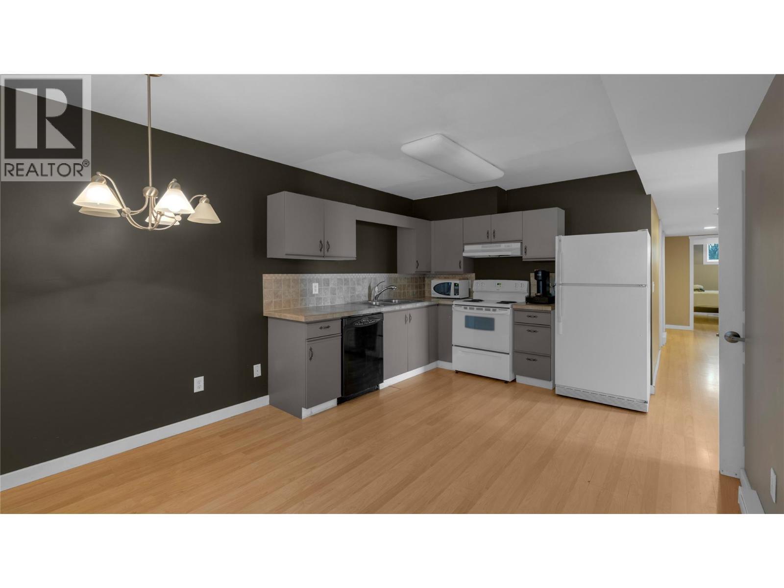 IN-LAW SUITE - Kitchen & Hallway to Bedroom & Den - 3065 Lakeview Cove Road, West Kelowna, BC - Indoor Photo Showing Kitchen