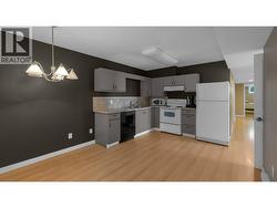 IN-LAW SUITE - Kitchen & Hallway to Bedroom & Den -