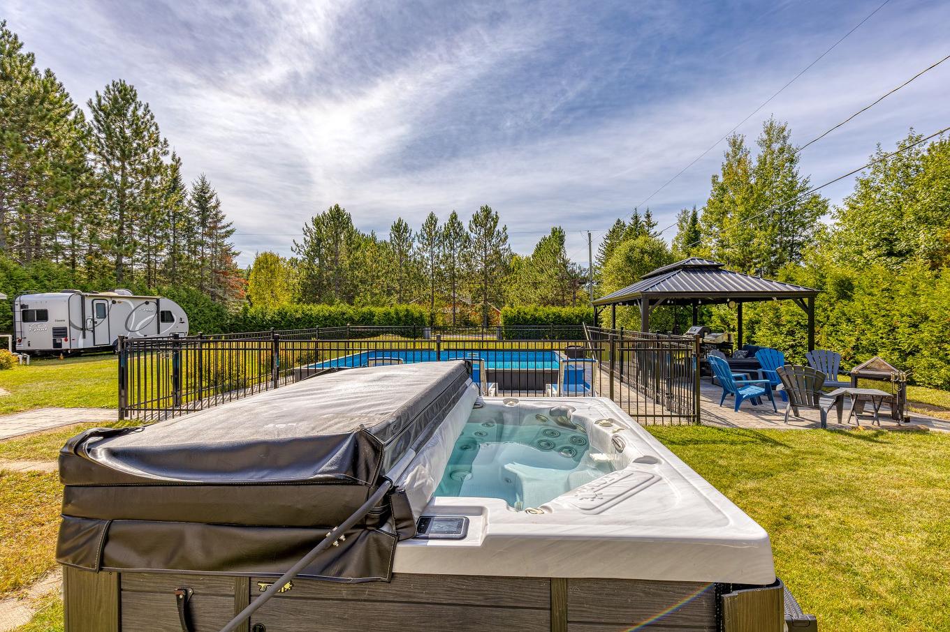 Spa - 161 Rue St-Paul, Saint-Côme, QC - Outdoor With Backyard