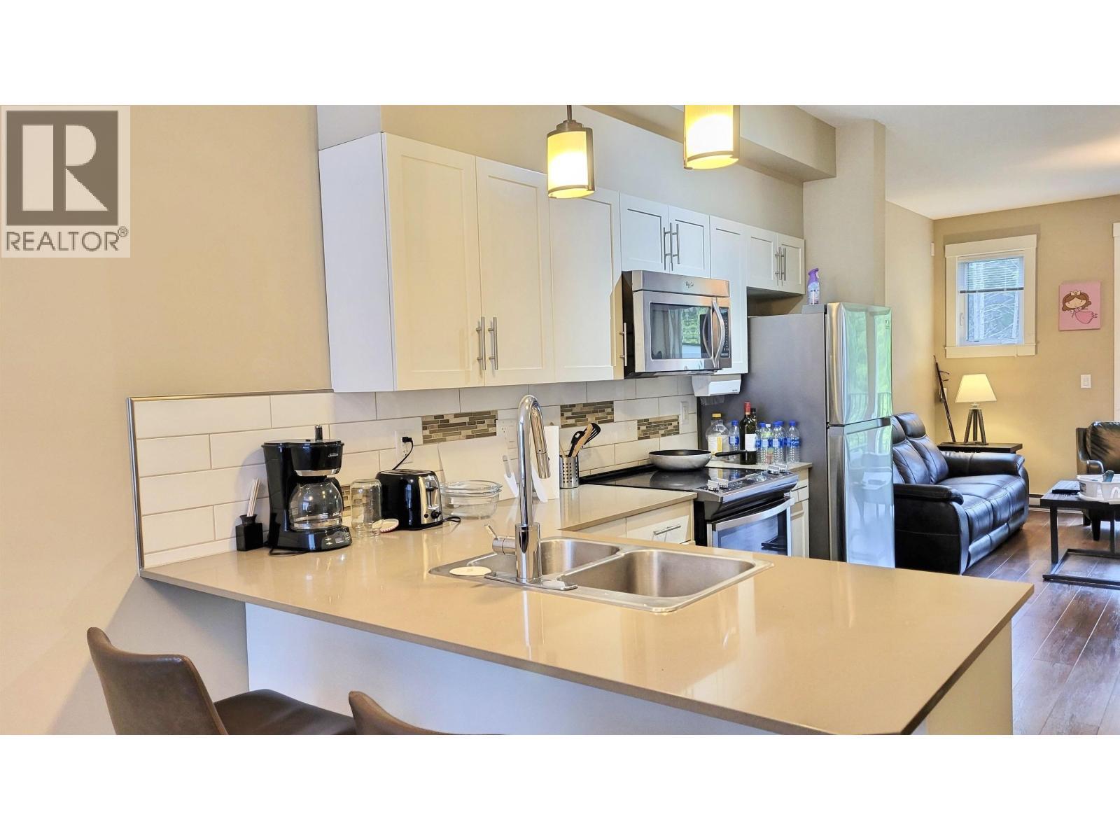 205 110 Baxter Avenue, Kitimat, BC - Indoor Photo Showing Kitchen With Double Sink