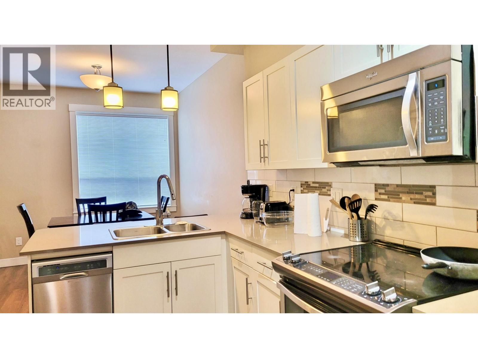 205 110 Baxter Avenue, Kitimat, BC - Indoor Photo Showing Kitchen With Double Sink