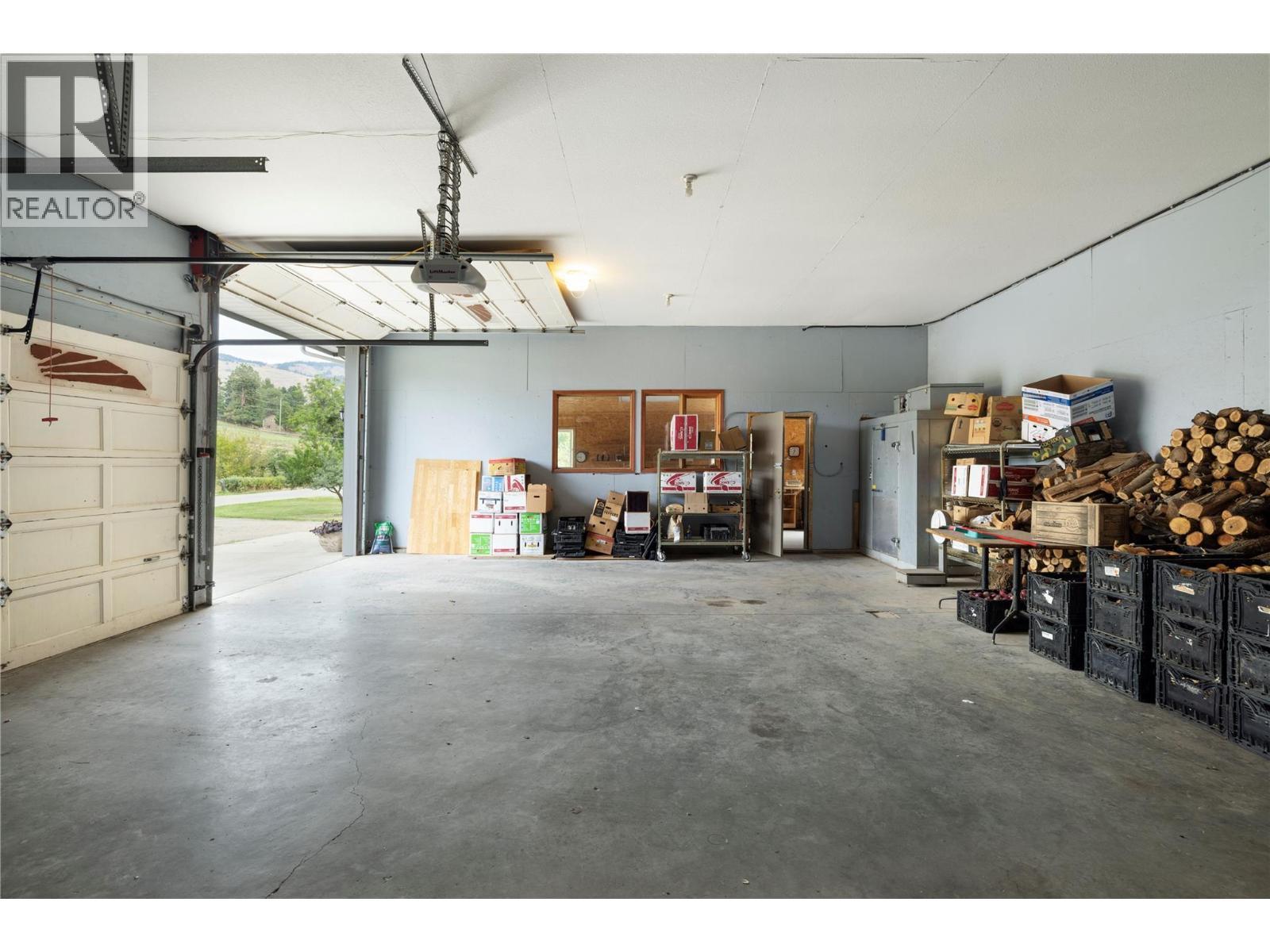 Massive Triple Garage - 10108 Venables Drive, Coldstream, BC - Indoor Photo Showing Garage