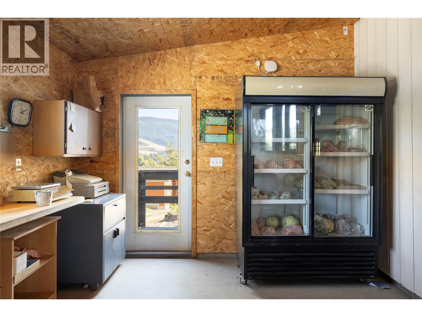 Glass Front Cooler - 10108 Venables Drive, Coldstream, BC - Indoor Photo Showing Kitchen