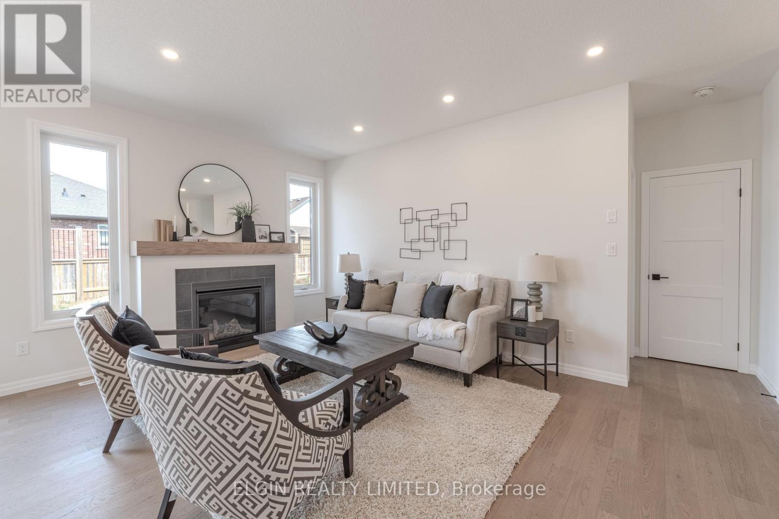 42197 Mcbain Line, Central Elgin, ON - Indoor Photo Showing Living Room With Fireplace