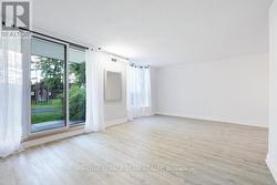 Living Room / Patio Doors leading to Outdoor Pool -