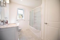 Main floor bathroom with linen closet -