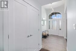 Greeted by a sunfilled foyer with soaring ceilings -