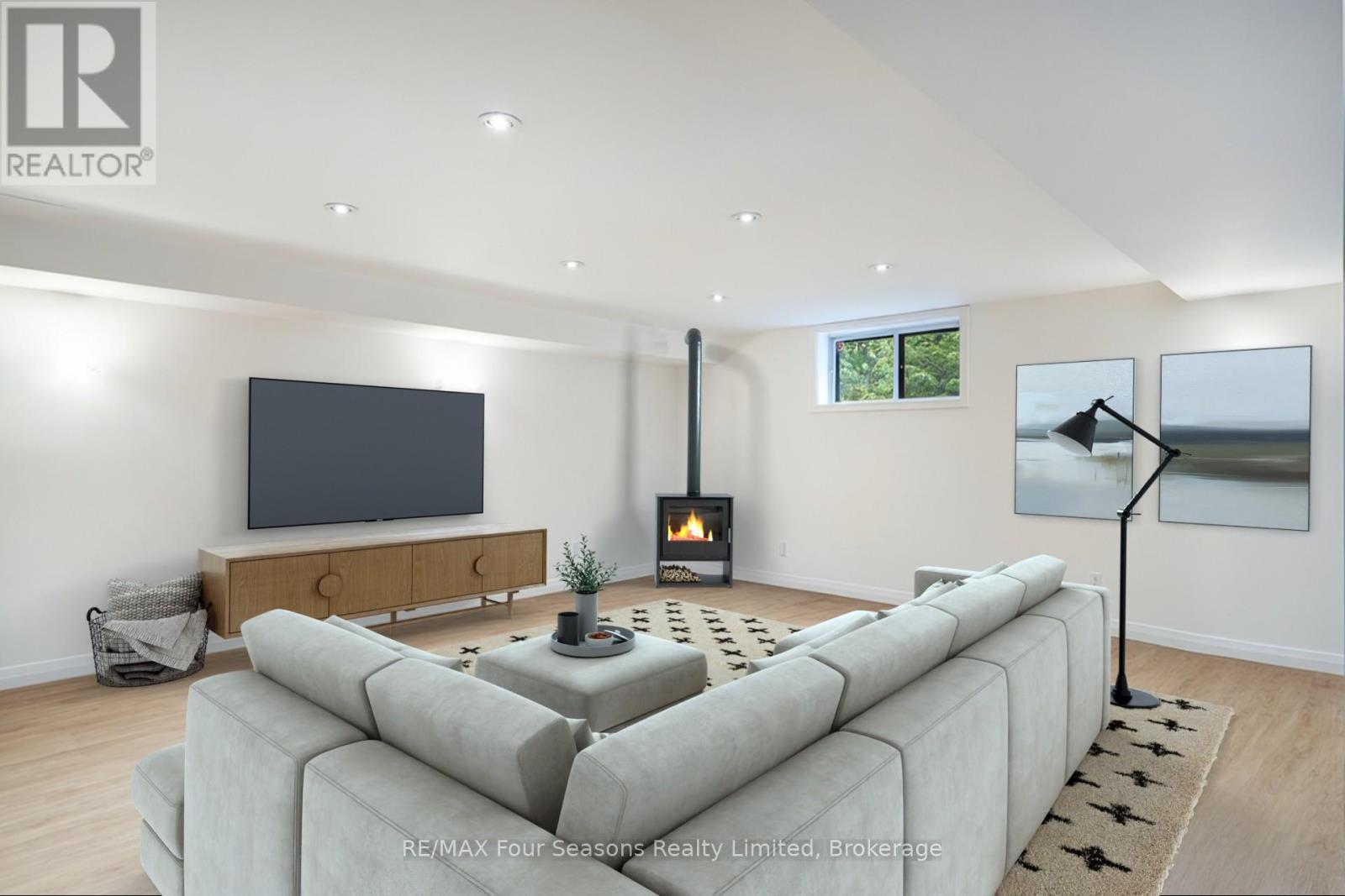 Staged Lower level - 159 Indian Circle, Blue Mountains, ON - Indoor Photo Showing Living Room With Fireplace