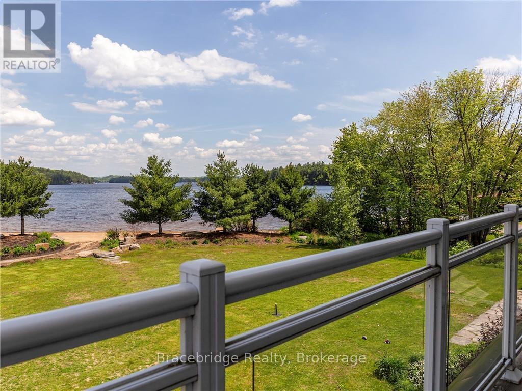 G103-D1 - 1869 Muskoka 118 Highway W, Muskoka Lakes (Monck (Muskoka Lakes)), ON - Outdoor With Body Of Water With Balcony With View