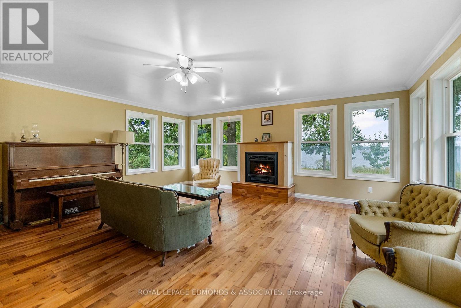 Living Room Overlooking the River - 1095 Mountainview Drive, Laurentian Valley, ON - Indoor Photo Showing Living Room With Fireplace