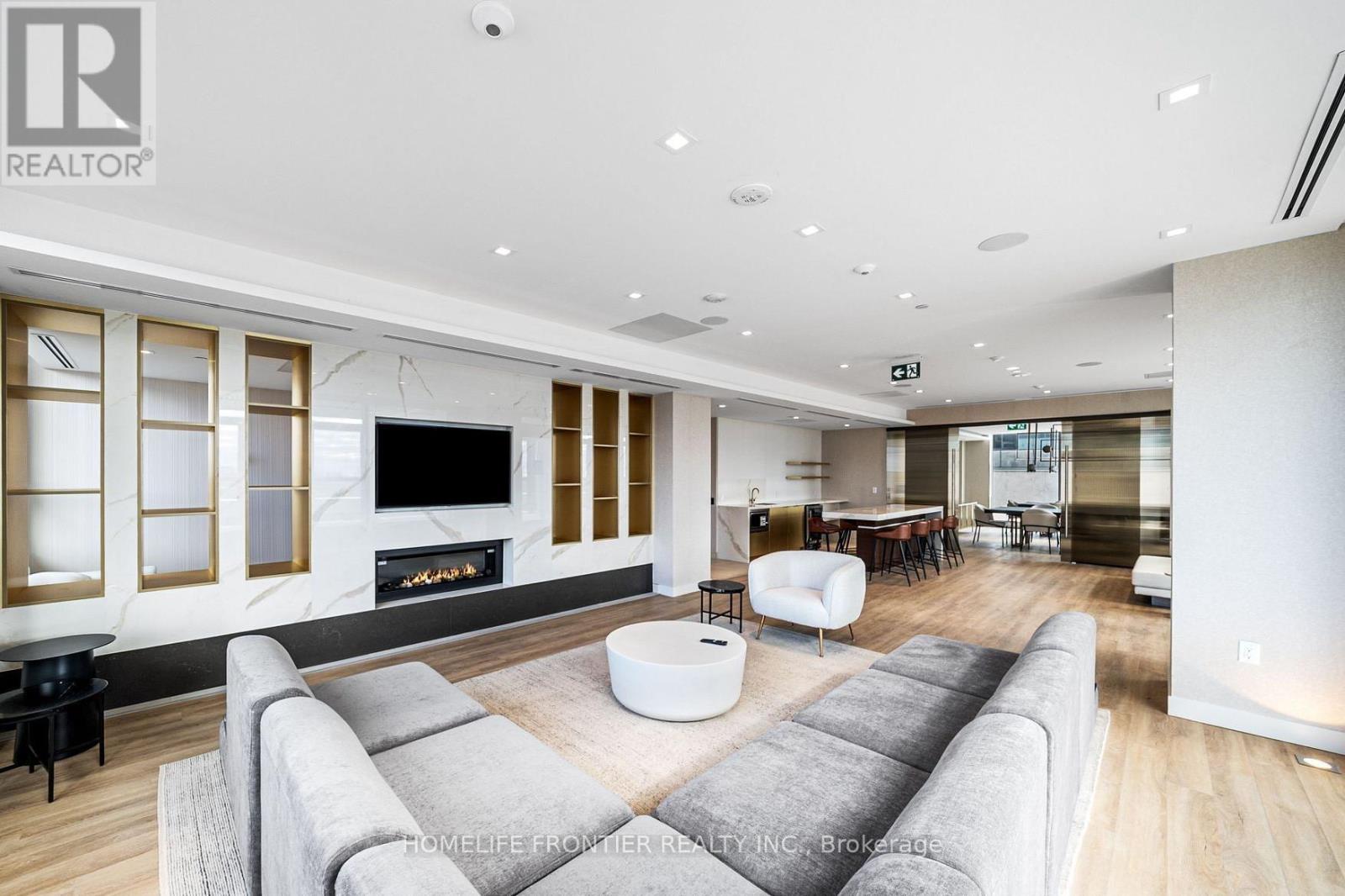 S1103 - 8 Olympic Garden Drive, Toronto, ON - Indoor Photo Showing Living Room With Fireplace